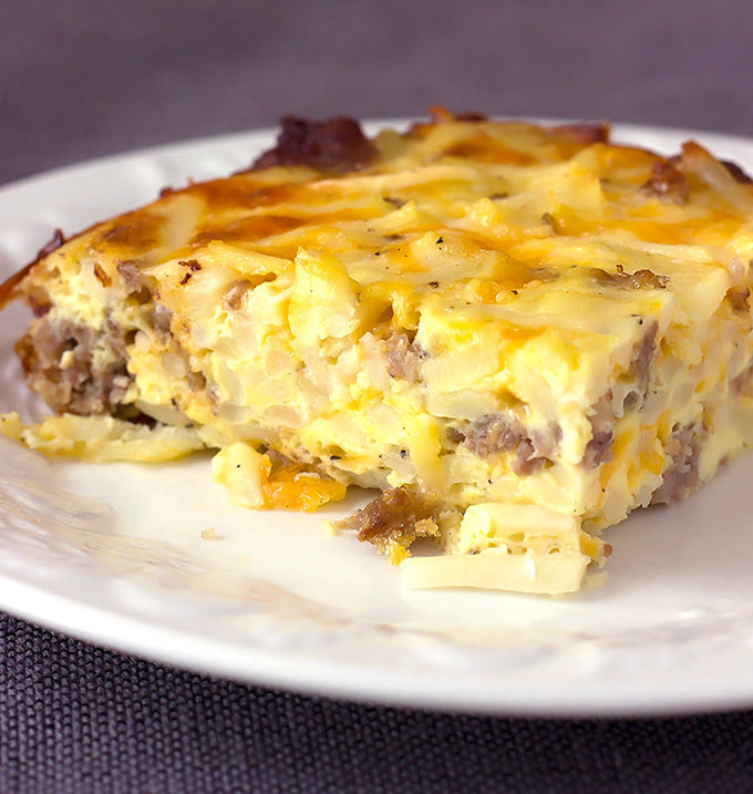 slice of Sausage Hash Brown Breakfast Casserole on a white plate