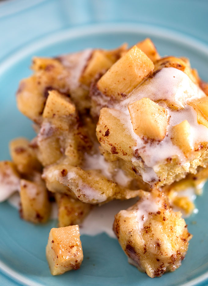 one serving of Crock Pot Apple Cinnamon Roll Casserole on a blue plate