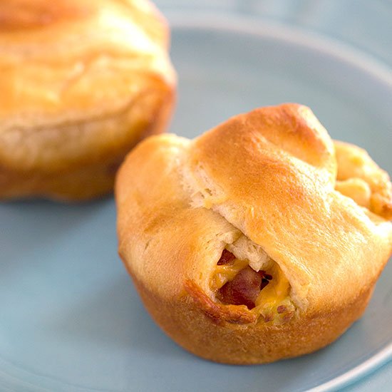 2 stuffed crescent rolls on a blue plate