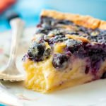 piece of buttermilk custard blueberry pie