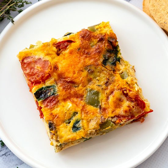 piece of loaded vegetable egg bake on a plate