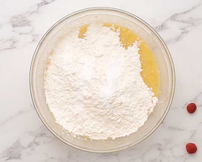 bowl of banana bread ingredients that have not been mixed together.