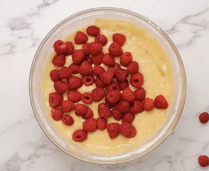 raspberry banana bread batter in a mixing bowl