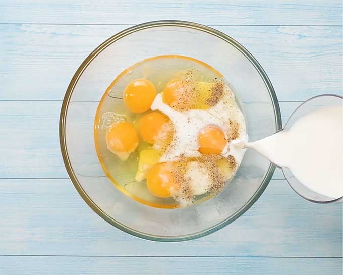 Mixing bowl with egg and milk.