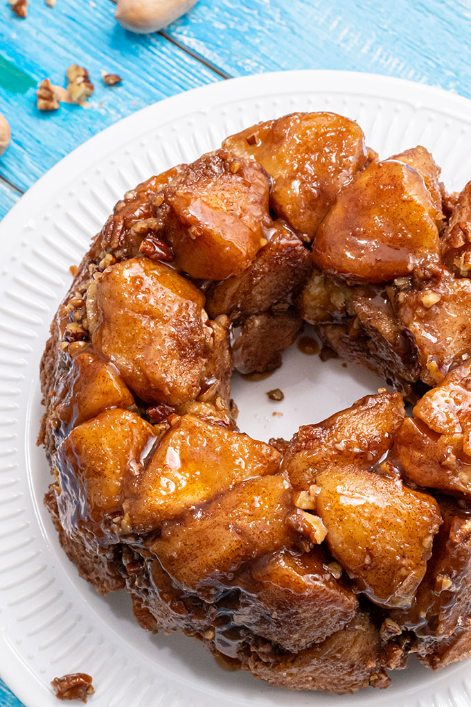 Baked monkey bread in a ring shape on a white plate