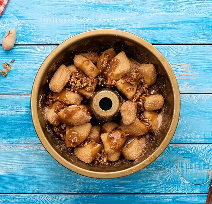 bundt pan full of unbaked monkey bread ingredients