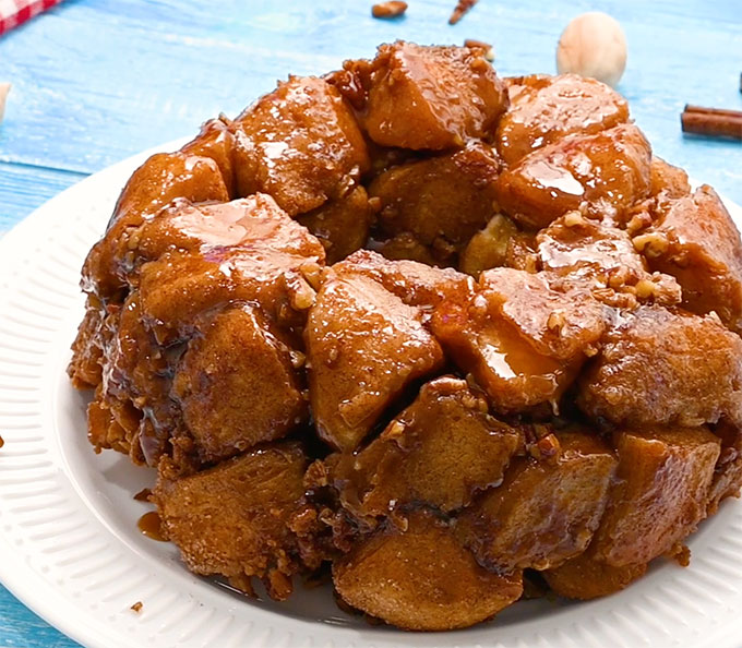 a whole baked monkey bread on a white plate