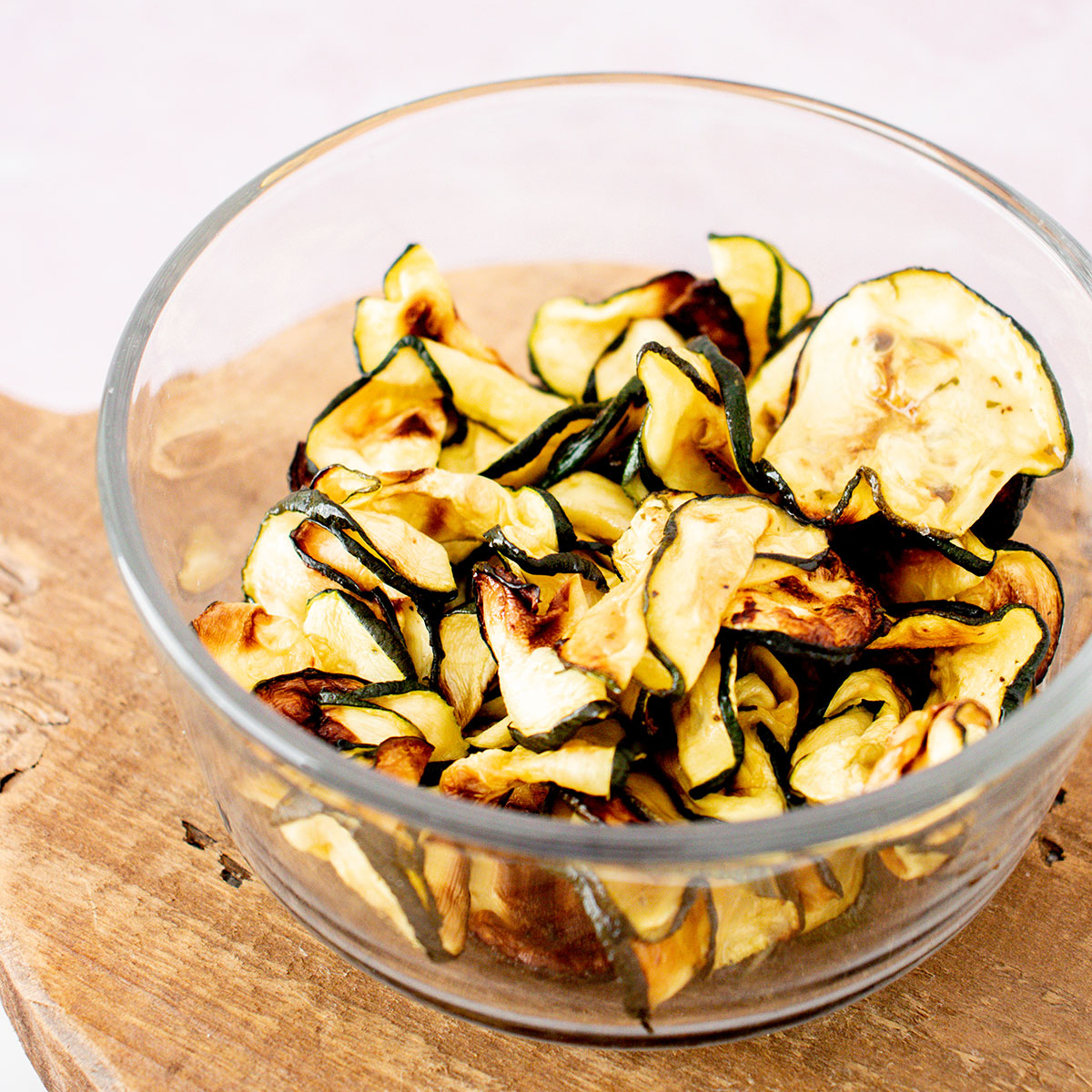 glass bowl full of air fried ranch zucchini chips