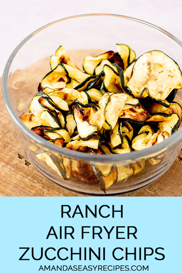 glass bowl full of air fried ranch zucchini chips with text overlay