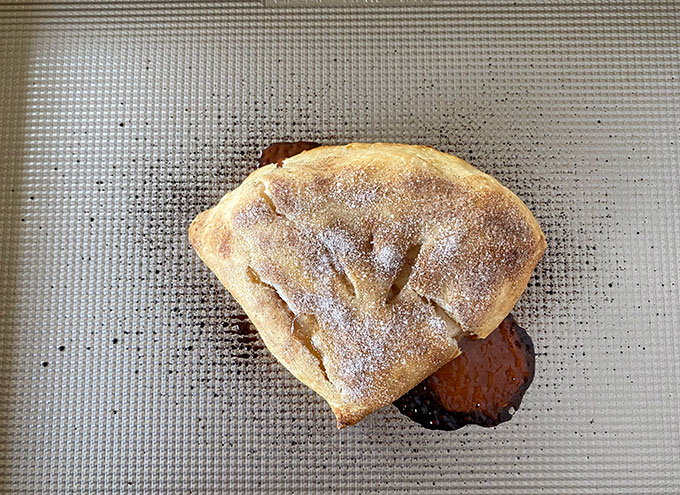 Baked folding apple pie hack on a baking sheet