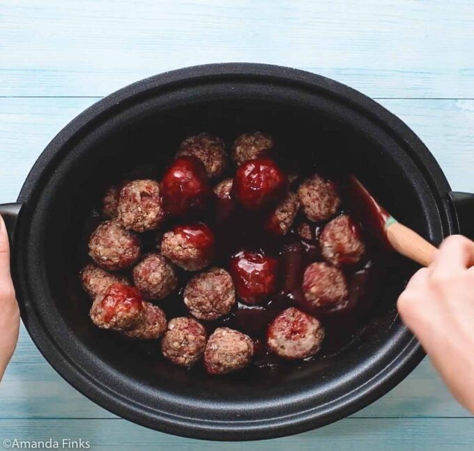 frozen meatballs in a crock pot with grape jelly and barbecue sauce