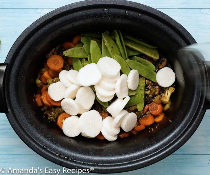 water chestnuts and peas added to slow cooker