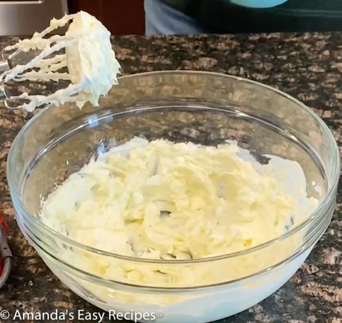 Cream Cheese whipped in a mixing bowl.